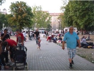 The park between the bus and train stations is now a makeshift refugee camp.
